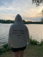 Load image into Gallery viewer, PREORDER- The World Still Needs You Hoodie - Sand
